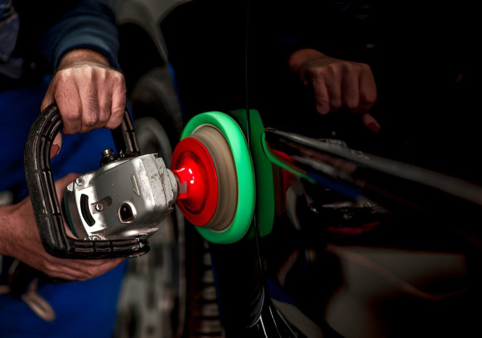 A car with hail damage being inspected for resale value."