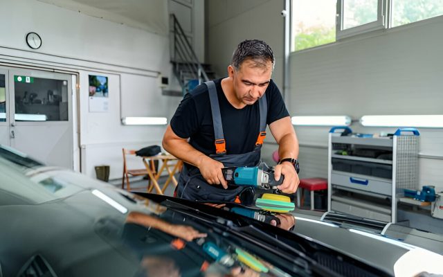 A car dealership preparing used cars with PDR before resale."