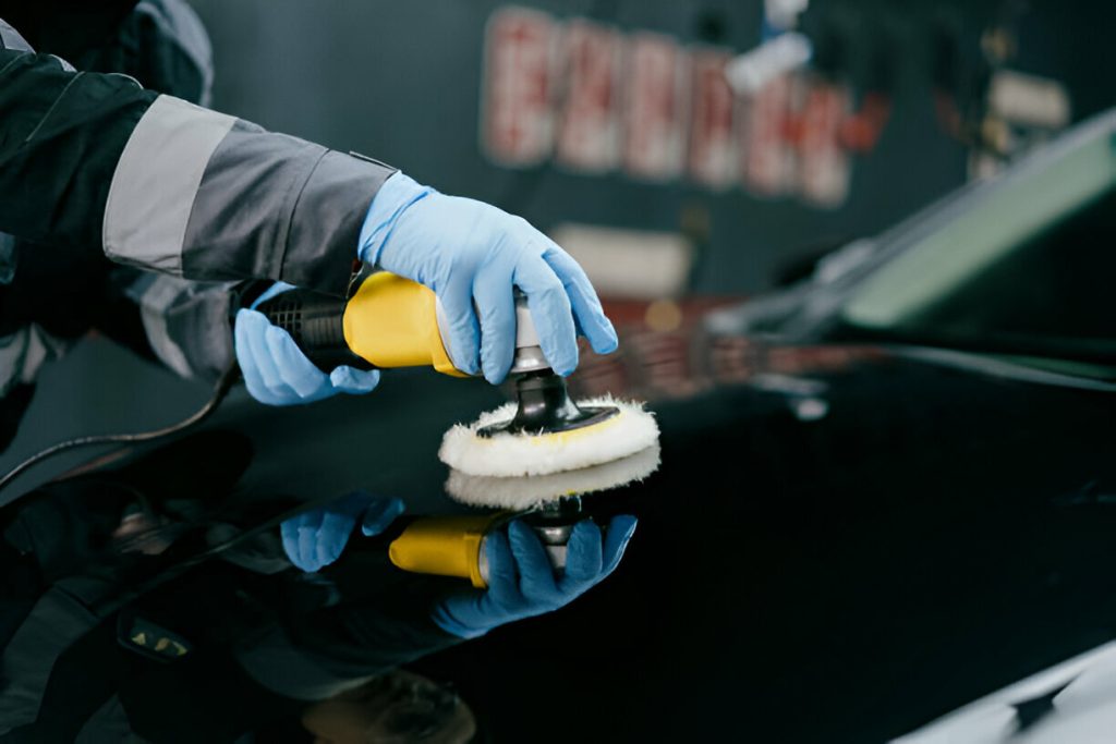 "A driver inspecting a fresh dent on their car’s door."