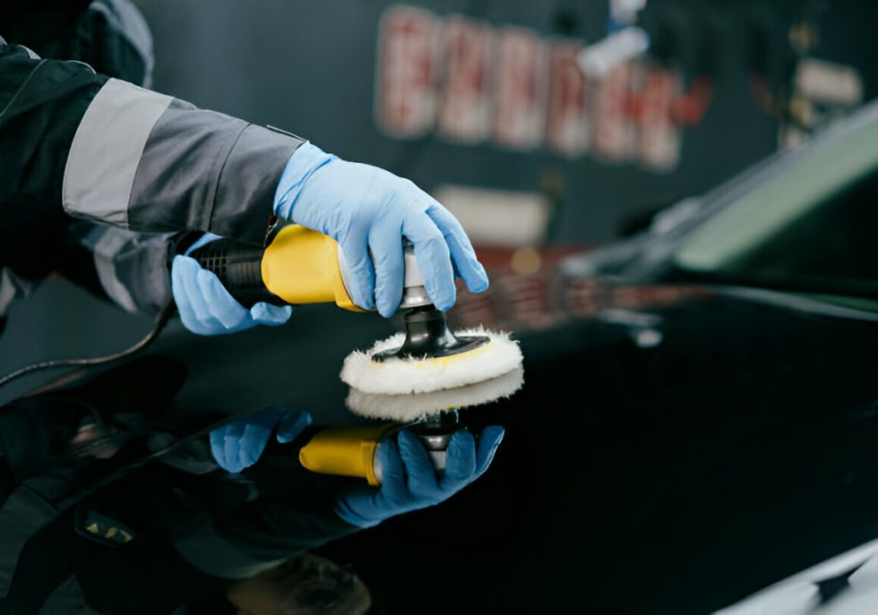 "A driver inspecting a fresh dent on their car’s door."