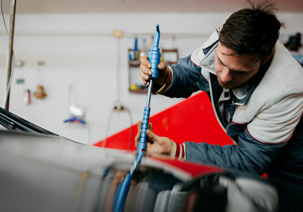 "A driver carefully parking their car to avoid door dings."